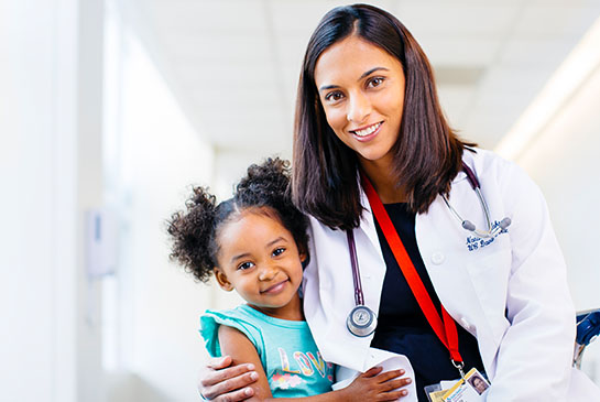 UC Davis pediatrician with young patient