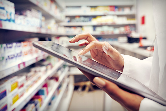 Tablet being used in a pharmacy by health care worker