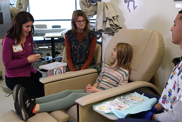 Health care workers supporting child patient