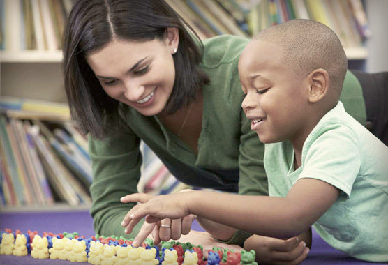 CAARE provider playing with young boy