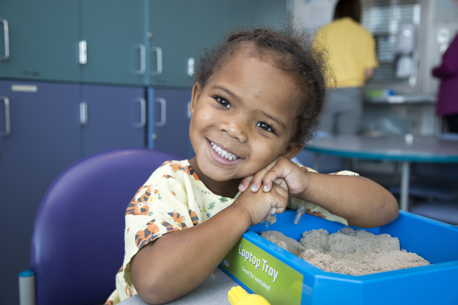 child playing with sand