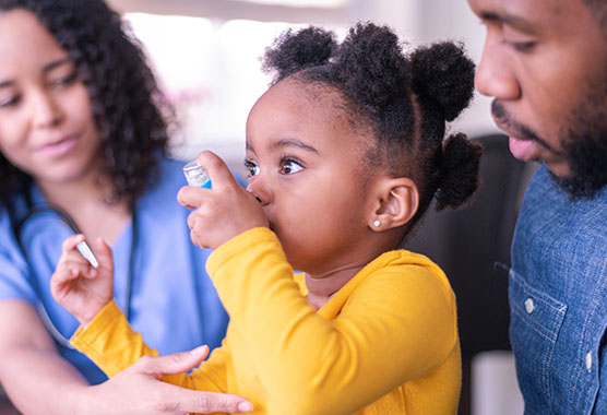 Young pediatric patient with asthma inhaler