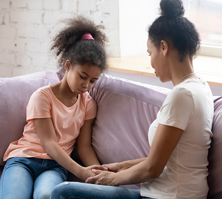 Mom is talking to a girl holding hand