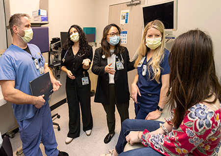 pediatric asthma clinic team with patient