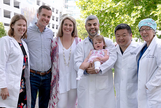 Evie Harden with her parents and care team