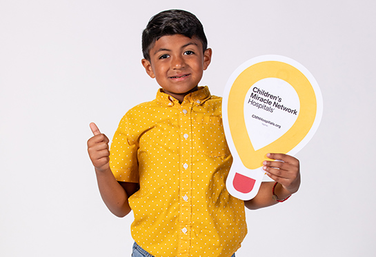 Boy holding balloon