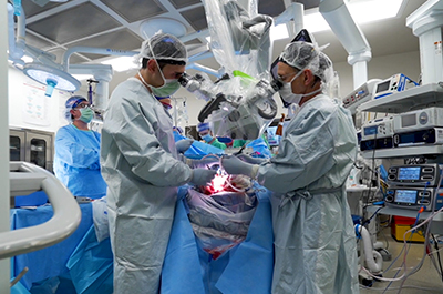 Surgeons working on conjoined twins.