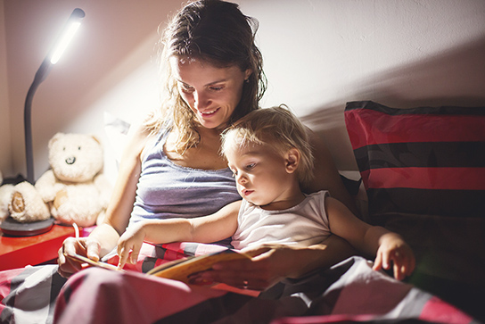 mom and baby on the bed