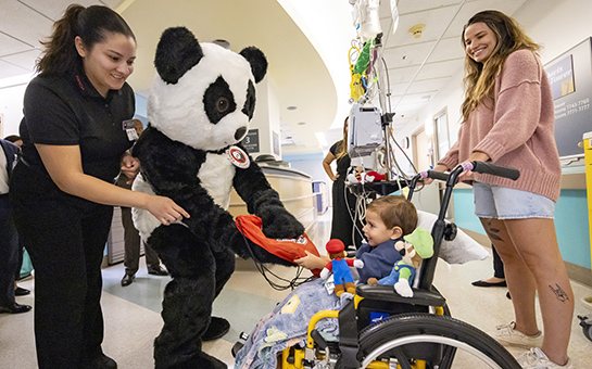 Nurse and patient during the opening of the Panda Cares Center of Hope