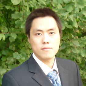 Yi Zhang, a senior statistician, wearing a tie and jacket