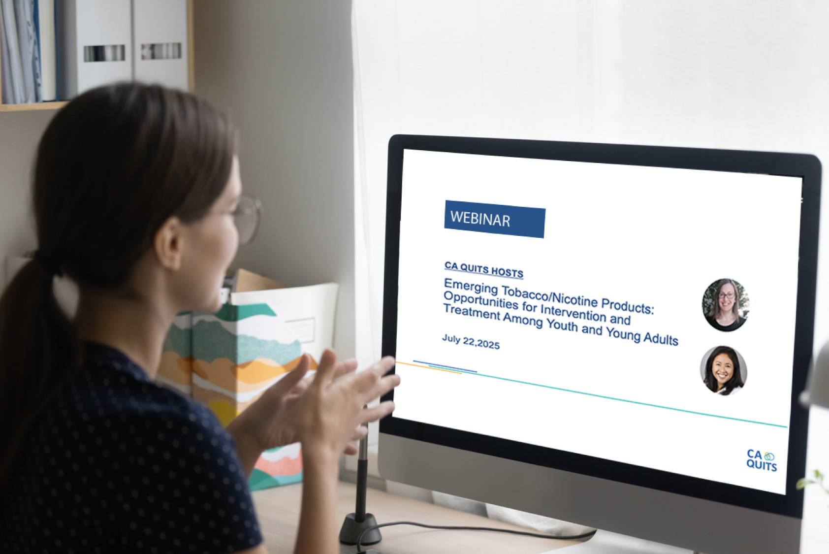 Person viewing a webinar presentation on a computer