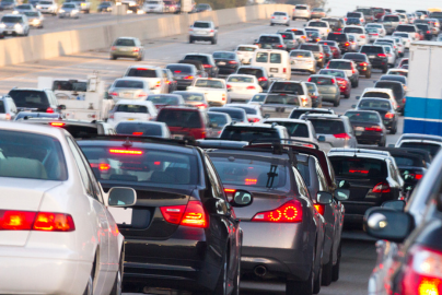 Cars in traffic on a crowded highway. 