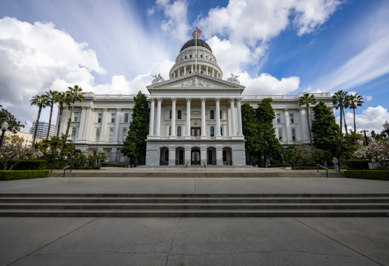 A view of the California state capitol building from the front.