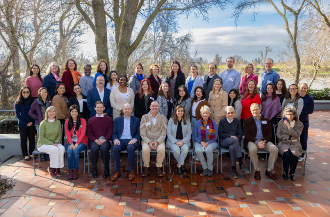 A large group photo of the CHPR team outdoors. 