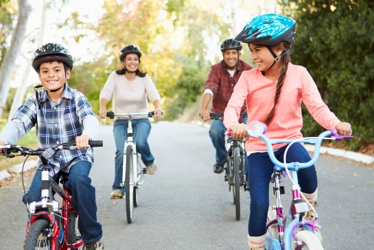 family riding bikes together