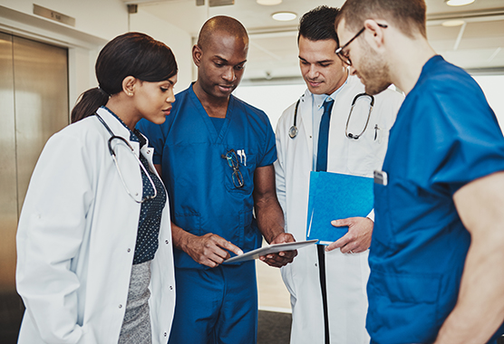 Doctor huddle (C) Adobe stock. All rights reserved.