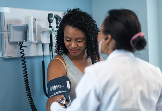 Female patient getting her blood pressure tested