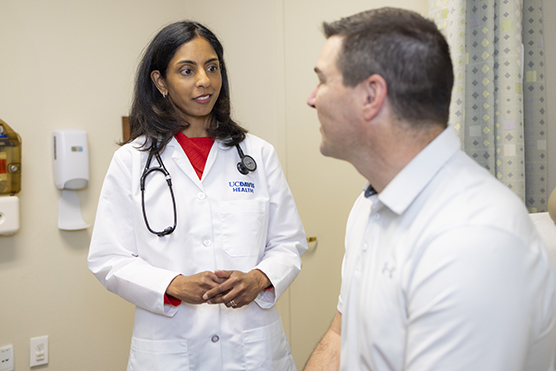 Female physician and male patient in an exam room