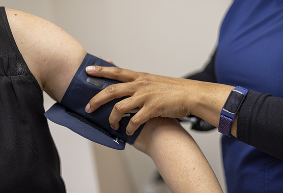 Person getting their blood pressure taken in clinic.