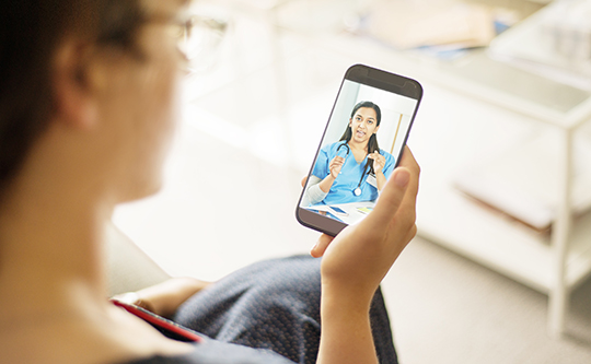 Patient talking to a doctor using a mobile phone