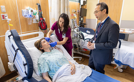 Female patient getting electrodes removed from her head after EEG test.