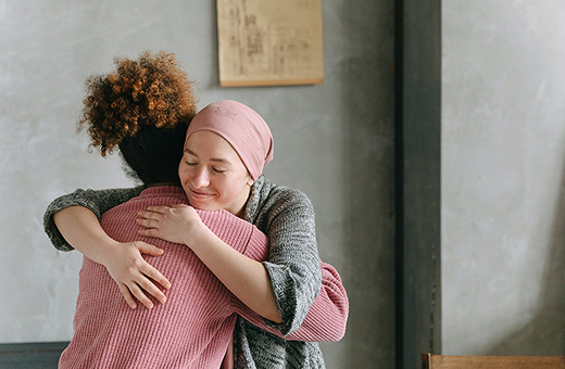 Female patient hugging a loved one