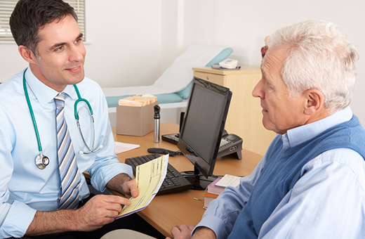 Health care provider discussing information with patient before surgery