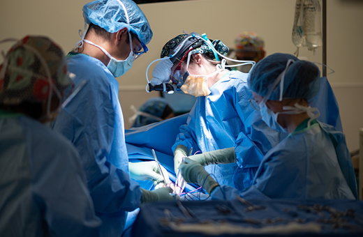 Neurosurgeons operating on patient with neurotrauma