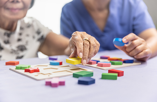 Patient solving puzzle as part of neurosychological test.