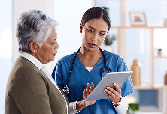 Neurologist discussing neuropsychology with older patient.