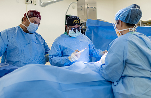 Surgeons working on a patient in the surgery room