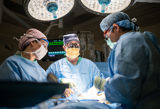Surgeons performing pituitary tumor surgery on patient.