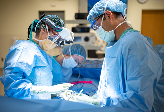 Neurosurgeons performing skull base surgery.