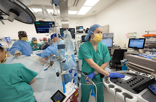 Surgeons performing TAVR on patient.