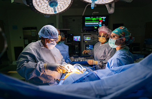 Thoracic surgeons operating on patient.