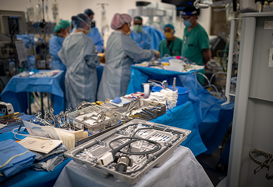 Neurosurgeons performing vascular neurosurgery on patient.