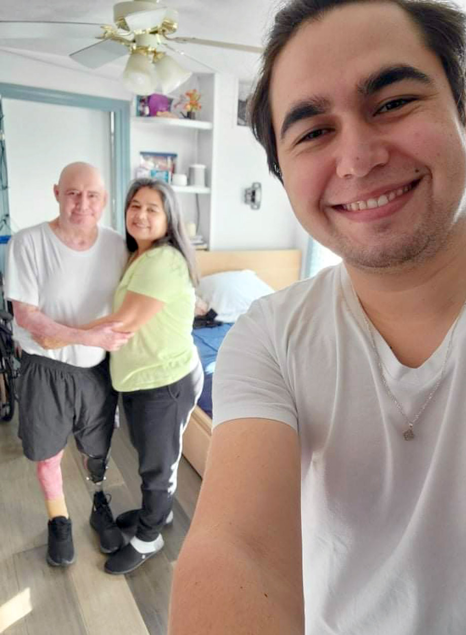 Silvestre Romo Llamas in foreground with his parents Fonseco and Berta standing behind him.