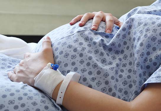 pregnant woman on exam table