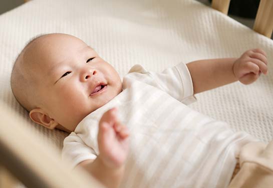 baby sleeping on its back