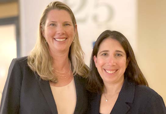 Melissa Bauman and Debbie Aizenberg standing next to each other smiling