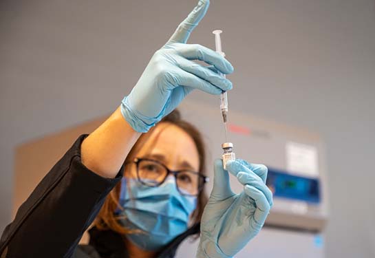 Healthcare worker preparing a monkeypox vaccine