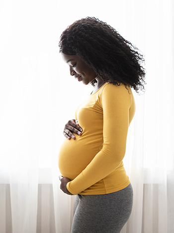 Pregnant belly of a black woman