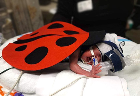 Scarlett dressed as a ladybug for Halloween