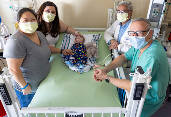 Gary Raff, Frank Ing with patient Carter Vincent and his parents Elizabeth and Christine 