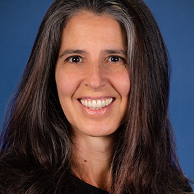 head and shoulder photo of woman with medium-length grey hair