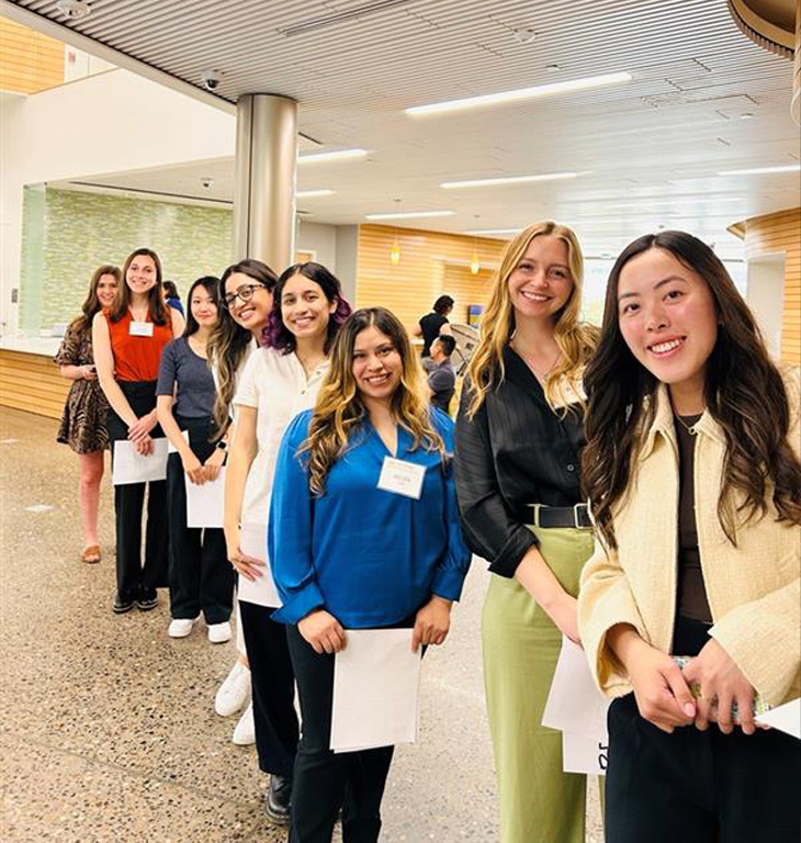 Students lined up behind in each in building commons area