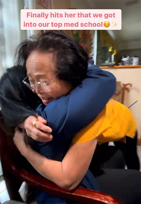 Young woman and her mother embrace