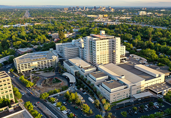 Large building with Sacramento city skyline in the distance