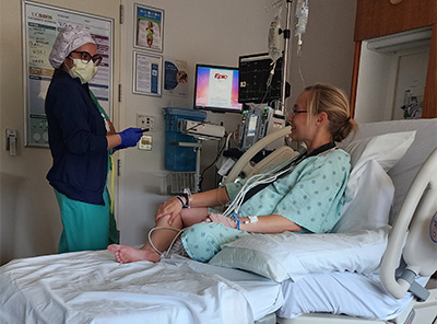 Stephanie in a hospital bed