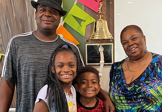 10-year-old African American boy, his 11-year-old sister, their dad and their grandmother